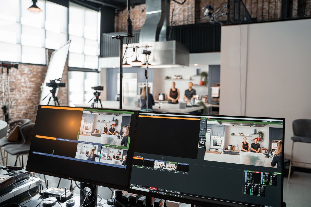 Multi-monitor live production studio setup for switching between event camera feeds