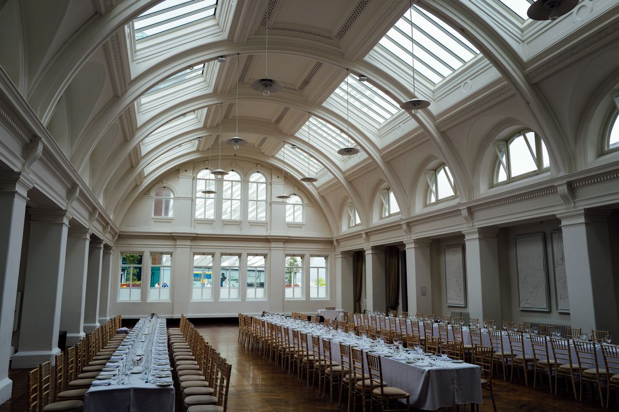 Elegant banquet hall with arched skylight ceiling set up for a formal gala event in the UAE