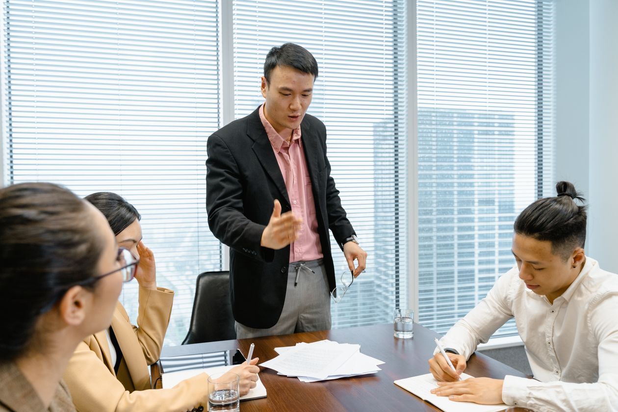 Business professionals discussing strategy during a corporate meeting in a modern boardroom