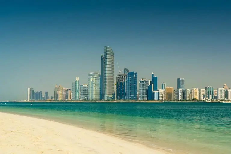 Abu Dhabi city skyline across the sea on a clear day